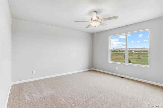 unfurnished room featuring carpet floors and ceiling fan