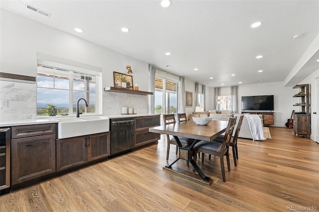 1601 Mariah Ln, Erie, CO 80516 - dining space with recessed lighting, light wood finished floors, and beverage cooler