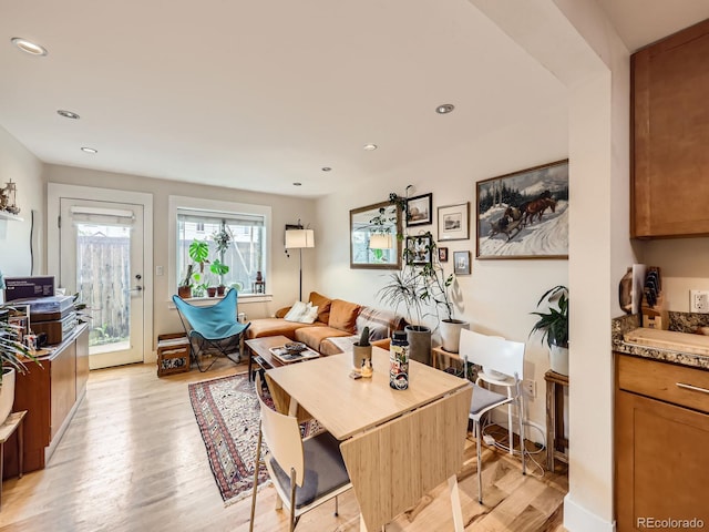 2460 W Caithness Pl Unit 105, Denver, CO 80211 - dining room featuring light wood-style floors and recessed lighting