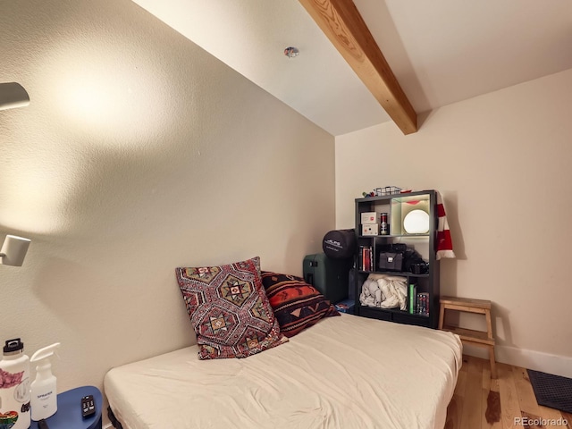 2460 W Caithness Pl Unit 105, Denver, CO 80211 - bedroom with beam ceiling and wood finished floors