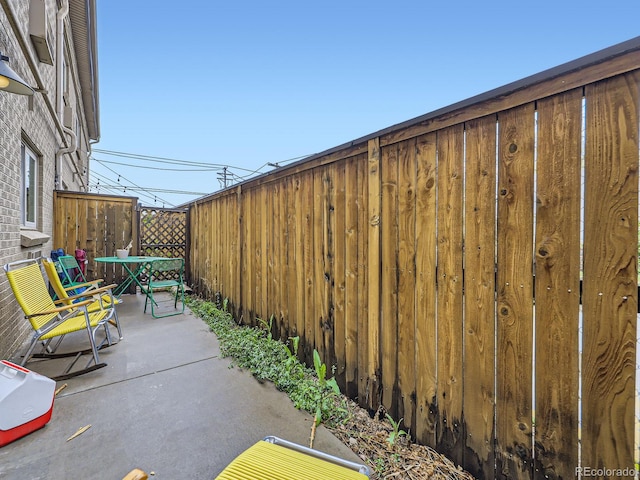 2460 W Caithness Pl Unit 105, Denver, CO 80211 - view of patio / terrace with fence