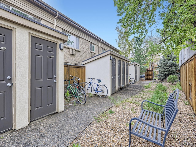 2460 W Caithness Pl Unit 105, Denver, CO 80211 - view of yard with fence, an outbuilding, and a storage shed