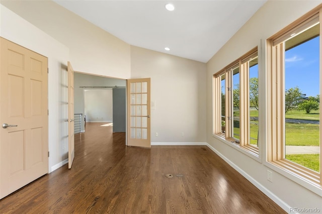 15132 Pecos St, Broomfield, CO 80023 - empty room featuring french doors, lofted ceiling, baseboards, dark wood-style floors, and recessed lighting