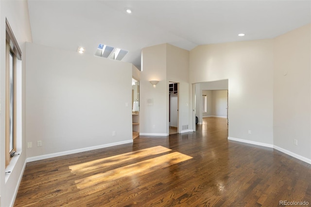 15132 Pecos St, Broomfield, CO 80023 - empty room with wood finished floors, baseboards, recessed lighting, and high vaulted ceiling