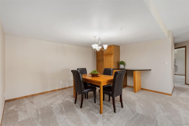 15132 Pecos St, Broomfield, CO 80023 - dining room with light colored carpet, a chandelier, and baseboards