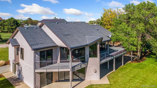 15132 Pecos St, Broomfield, CO 80023 - rear view of property featuring a shingled roof and a yard