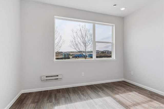 453 Interlocken Blvd Unit 101, Broomfield, CO 80021 - spare room featuring baseboards and wood finished floors