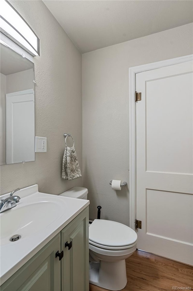 2041 7th Ave, Greeley, CO 80631 - bathroom with vanity and wood finished floors