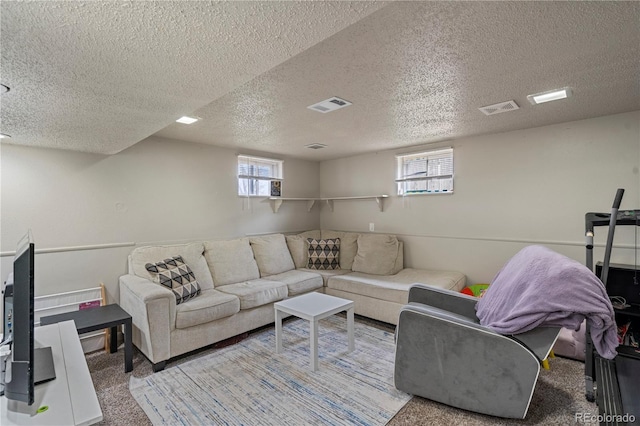 2041 7th Ave, Greeley, CO 80631 - carpeted living room featuring a textured ceiling and healthy amount of natural light