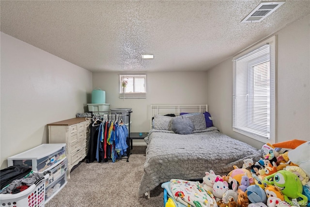 2041 7th Ave, Greeley, CO 80631 - bedroom with light carpet and a textured ceiling
