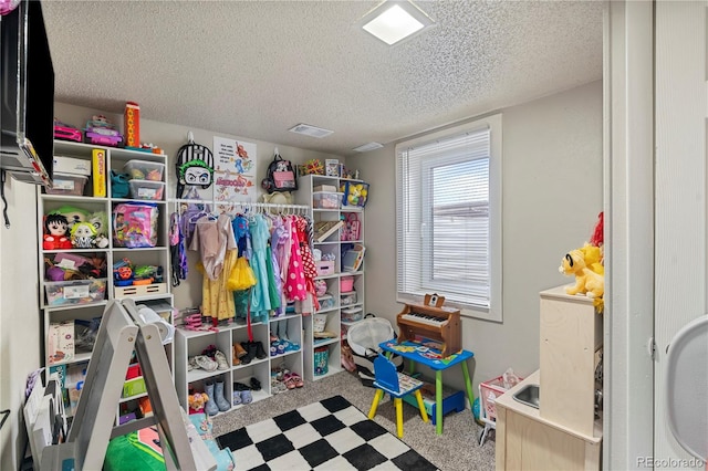 2041 7th Ave, Greeley, CO 80631 - rec room featuring a textured ceiling and carpet floors