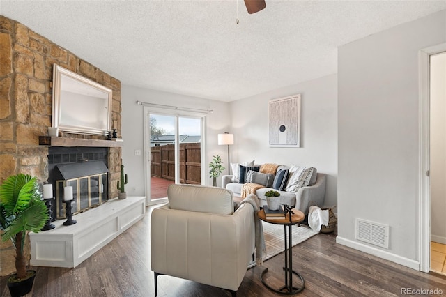 4160 Baytown Dr, Colorado Springs, CO 80916 - living room with dark wood-type flooring, a textured ceiling, and visible vents
