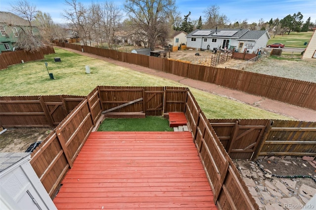 4160 Baytown Dr, Colorado Springs, CO 80916 - deck with a fenced backyard, a gate, a residential view, and a lawn