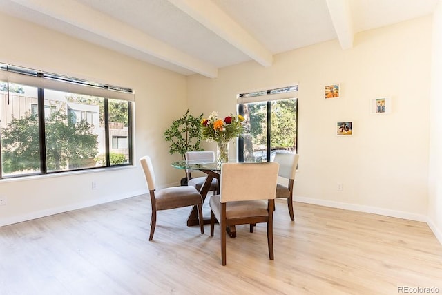 2525 S Dayton Way Unit 1201, Denver, CO 80231 - dining space with beamed ceiling, plenty of natural light, and light wood-style floors