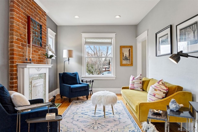 living area with hardwood / wood-style flooring