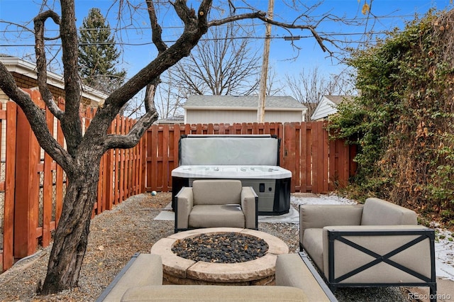 view of patio featuring a fire pit and a hot tub