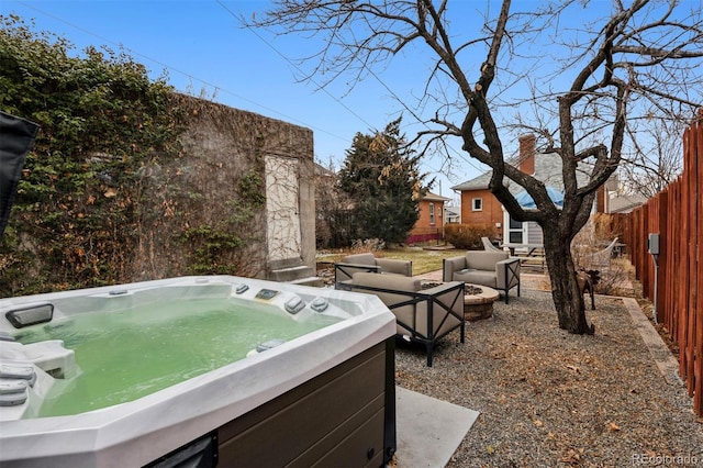 view of yard featuring an outdoor hangout area and a hot tub