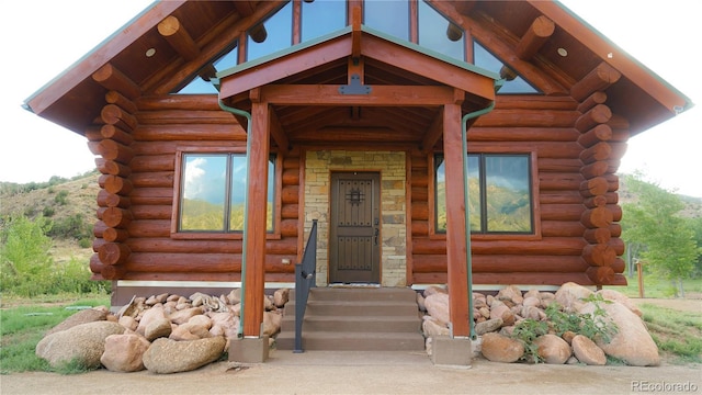 entrance to property featuring log exterior