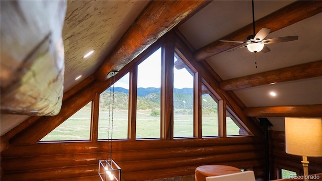 bonus room featuring vaulted ceiling with beams, a mountain view, and plenty of natural light