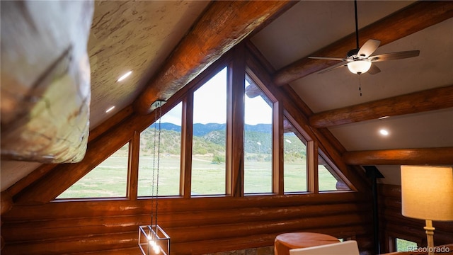 interior details with a mountain view, beamed ceiling, ceiling fan, and recessed lighting