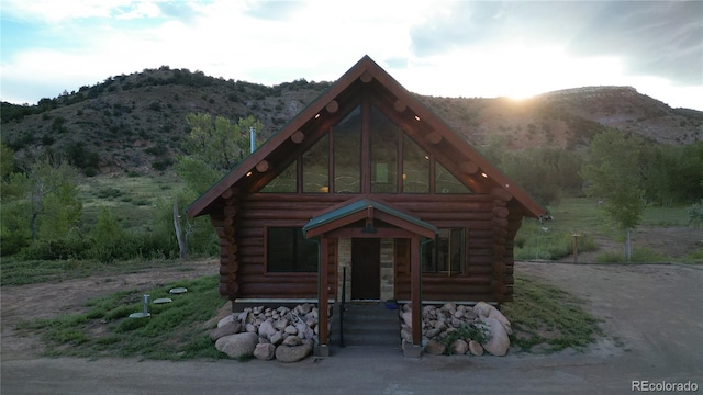 cabin featuring a mountain view