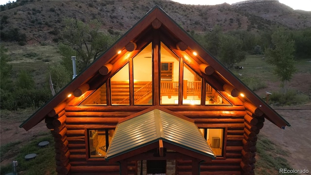 view of property exterior featuring a mountain view