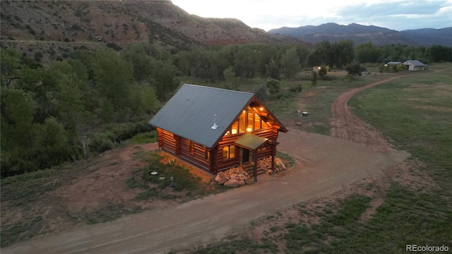 bird's eye view with a wooded view and a mountain view