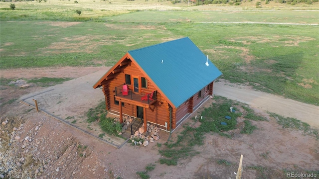 birds eye view of property with a rural view