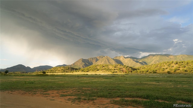 property view of mountains featuring a rural view