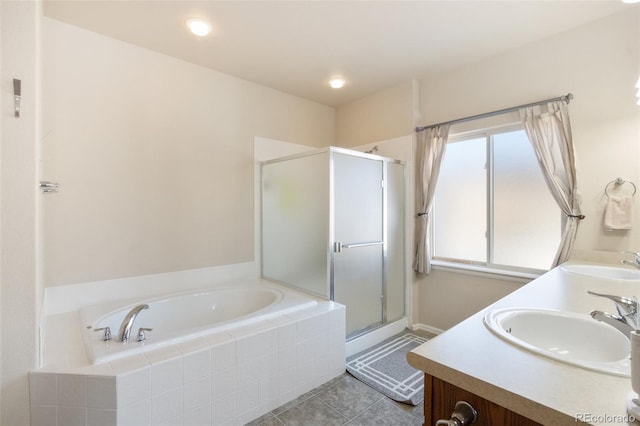 bathroom with tile patterned flooring, vanity, and separate shower and tub