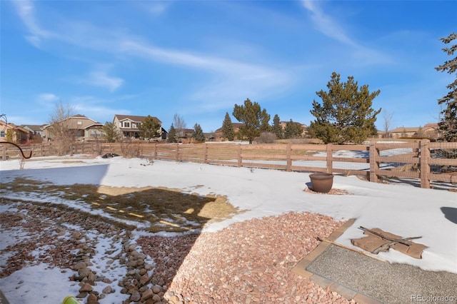 view of yard layered in snow