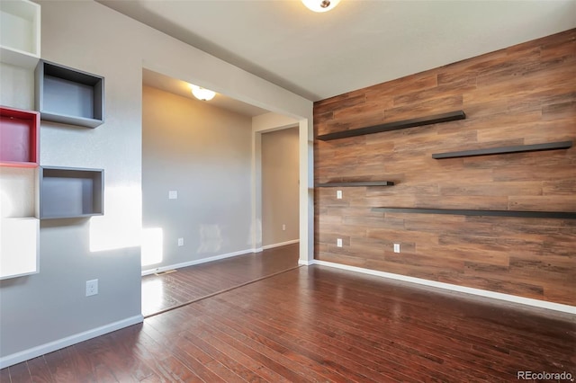 15955 E Otero Cir, Centennial, CO 80112 - unfurnished room with wooden walls and hardwood / wood-style floors