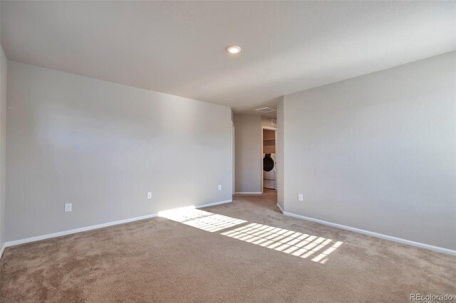 15955 E Otero Cir, Centennial, CO 80112 - spare room with washer / dryer and light colored carpet