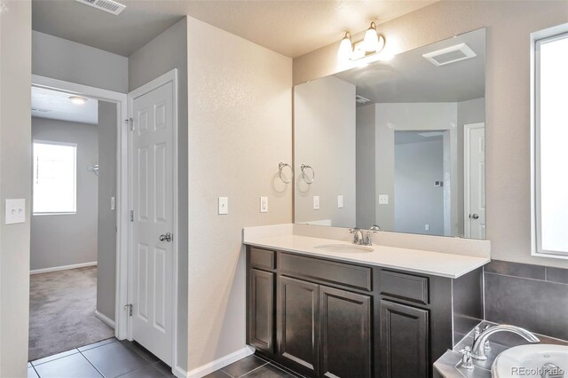 15955 E Otero Cir, Centennial, CO 80112 - bathroom featuring vanity and tile patterned flooring