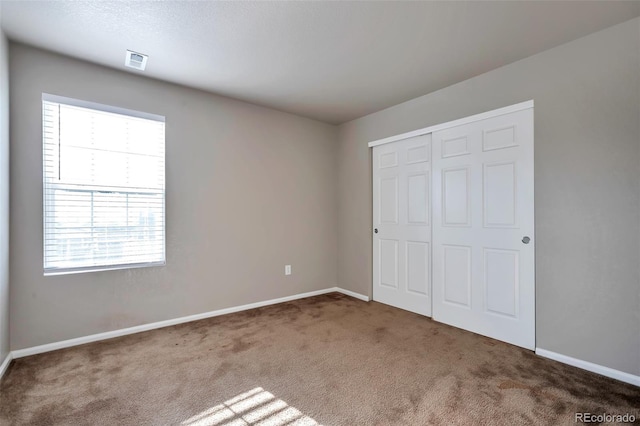 15955 E Otero Cir, Centennial, CO 80112 - unfurnished bedroom with carpet flooring and a closet