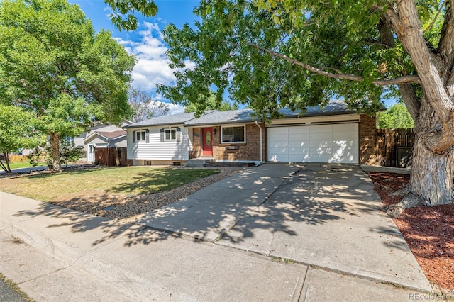 ranch-style house with a garage and a front lawn