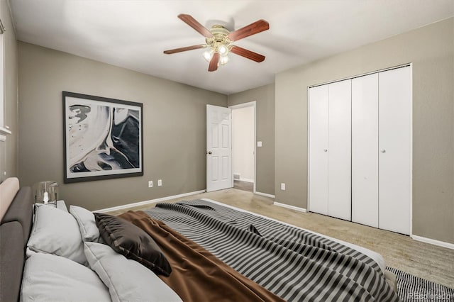 bedroom featuring ceiling fan and a closet