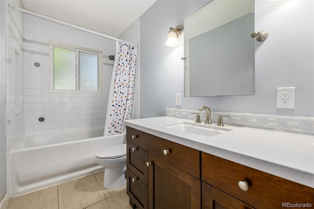 full bathroom with tile patterned flooring, toilet, shower / tub combo, tasteful backsplash, and vanity