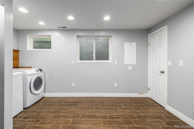 washroom with washer / dryer and dark hardwood / wood-style floors