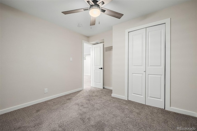 unfurnished bedroom with ceiling fan, light colored carpet, and a closet