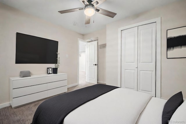 bedroom with ceiling fan, a closet, and light carpet