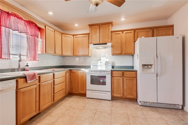 kitchen with decorative backsplash, sink, light tile patterned floors, and white appliances