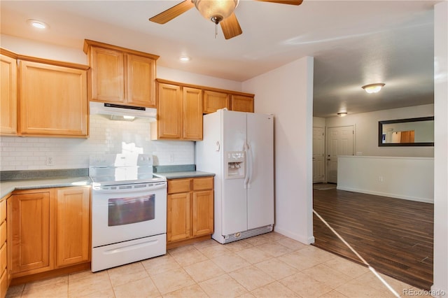 kitchen with decorative backsplash, ceiling fan, white appliances, and light hardwood / wood-style flooring