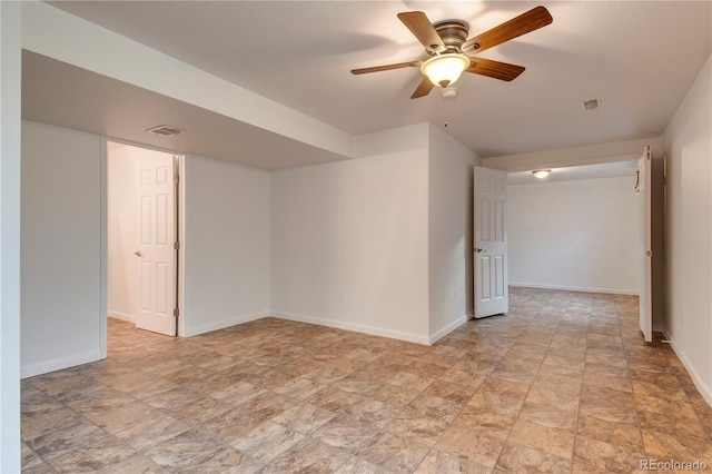 spare room with ceiling fan