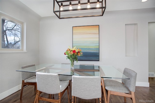 dining space featuring dark hardwood / wood-style flooring