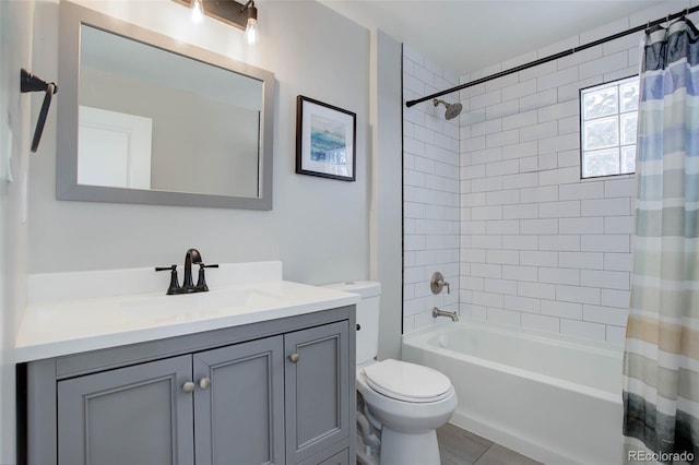 full bathroom featuring tile patterned floors, vanity, toilet, and shower / bathtub combination with curtain