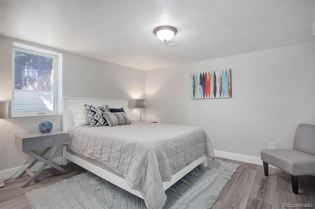 bedroom featuring hardwood / wood-style flooring