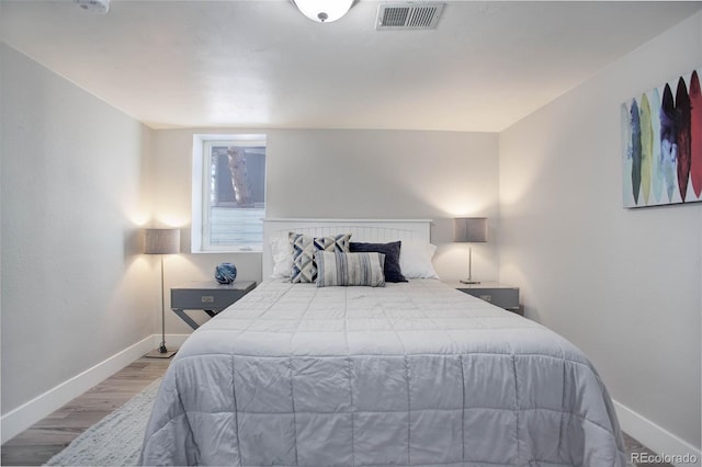 bedroom featuring hardwood / wood-style floors