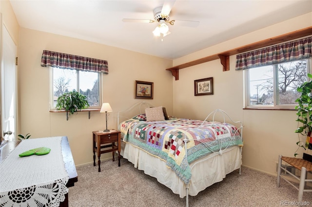 bedroom with baseboards, ceiling fan, and carpet floors