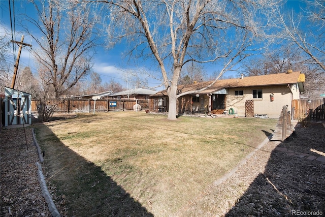 view of yard featuring a patio area and a fenced backyard